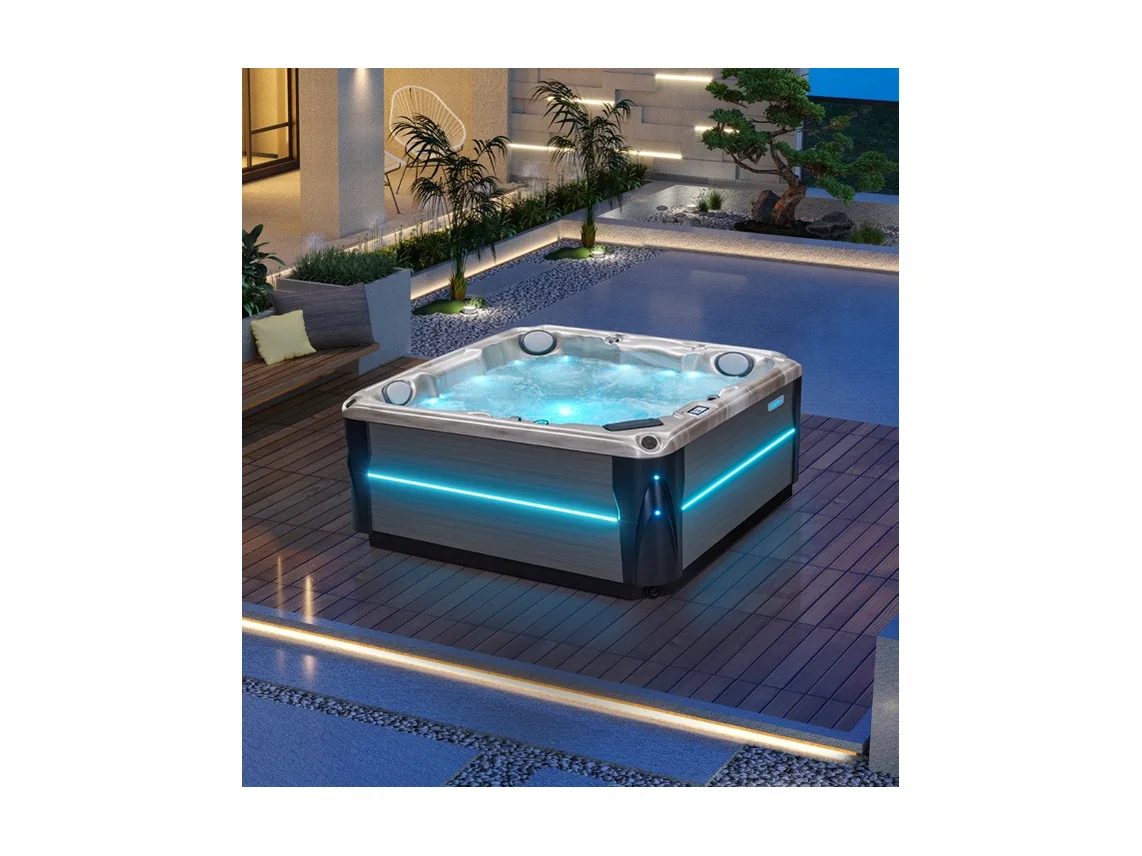 Спа-бассейн с подсветкой на деревянной террасе у воды